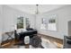 Well-lit bedroom with two large windows, hardwood floors, and a comfortable daybed at 907 Piedmont Ne Ave # 7, Atlanta, GA 30309