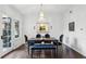Charming dining room features hardwood floors, chandelier lighting, and a view to the outdoors at 907 Piedmont Ne Ave # 7, Atlanta, GA 30309