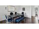 Traditional dining room with dark wood table, blue upholstered chairs, and matching bench at 907 Piedmont Ne Ave # 7, Atlanta, GA 30309