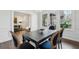 This dining room features wood floors, paneled walls, a chandelier, and lots of natural light at 907 Piedmont Ne Ave # 7, Atlanta, GA 30309