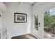 Bright entryway featuring a painted brick wall, picture frame, and French doors at 907 Piedmont Ne Ave # 7, Atlanta, GA 30309