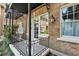 Close up of brick building showing balcony, windows and plants, and black iron details at 907 Piedmont Ne Ave # 7, Atlanta, GA 30309