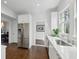 Charming kitchen with stainless steel appliances and white cabinets leading into the dining room at 907 Piedmont Ne Ave # 7, Atlanta, GA 30309