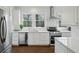 Updated kitchen with stainless steel appliances, white cabinets and countertops, and subway tile backsplash at 907 Piedmont Ne Ave # 7, Atlanta, GA 30309
