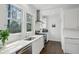 Modern kitchen with stainless steel appliances, white cabinetry, and ample natural light at 907 Piedmont Ne Ave # 7, Atlanta, GA 30309
