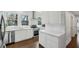 Bright kitchen with white cabinets, stainless steel appliances, and beautiful hardwood floors at 907 Piedmont Ne Ave # 7, Atlanta, GA 30309