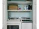 Laundry room with modern washer and dryer, and useful storage shelves at 907 Piedmont Ne Ave # 7, Atlanta, GA 30309