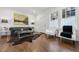 Bright living room with hardwood floors, stylish furnishings, and natural light streaming through a window at 907 Piedmont Ne Ave # 7, Atlanta, GA 30309