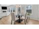 Contemporary dining area featuring a glass table, upholstered chairs, and natural light at 125 Sunland Blvd, Mcdonough, GA 30253