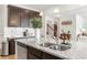Close-up of the kitchen island, featuring granite countertop and stainless steel sink at 125 Sunland Blvd, Mcdonough, GA 30253
