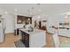 Bright, modern kitchen with island, stainless appliances, and adjacent living space at 125 Sunland Blvd, Mcdonough, GA 30253