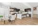 Modern kitchen with stainless steel appliances, a large island, seating, and an adjacent dining area at 125 Sunland Blvd, Mcdonough, GA 30253
