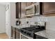 New kitchen featuring stainless steel appliances, a gas range and white subway tile backsplash at 125 Sunland Blvd, Mcdonough, GA 30253