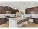Spacious kitchen features stainless steel appliances, a large island with seating, pendant lighting, and white subway tile at 125 Sunland Blvd, Mcdonough, GA 30253