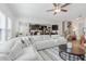 Expansive living room with fireplace offers access to the kitchen, staircase, and abundant natural light at 125 Sunland Blvd, Mcdonough, GA 30253