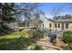 Lush backyard with a grill and a deck, ideal for outdoor activities and enjoying nature at 1989 Mount Vernon Rd, Atlanta, GA 30338
