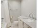 Neat bathroom featuring a tub and shower, a marble-top vanity, and modern fixtures at 1989 Mount Vernon Rd, Atlanta, GA 30338