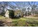 View of yellow home's exterior with a well-manicured lawn at 1989 Mount Vernon Rd, Atlanta, GA 30338