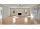 Spacious living room with fireplace, ceiling fan and large windows allowing lots of natural light at 1989 Mount Vernon Rd, Atlanta, GA 30338