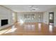 Spacious living room with fireplace, ceiling fan and large windows allowing lots of natural light at 1989 Mount Vernon Rd, Atlanta, GA 30338
