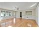 Spacious living room with fireplace, ceiling fan and large windows allowing lots of natural light at 1989 Mount Vernon Rd, Atlanta, GA 30338