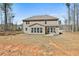 Home exterior showcasing a large backyard, perfect for outdoor activities and entertainment at 220 Eastmark Way, Fayetteville, GA 30214