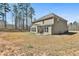 Spacious backyard with patio area offers a tranquil setting for outdoor gatherings and relaxation at 220 Eastmark Way, Fayetteville, GA 30214
