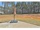 Backyard features a patio and grassy area ready for outdoor activities and relaxation at 220 Eastmark Way, Fayetteville, GA 30214