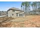 Expansive backyard with a well-maintained lawn, offering plenty of space for outdoor activities and relaxation at 220 Eastmark Way, Fayetteville, GA 30214
