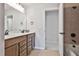 Bathroom featuring double vanity and a tub-shower combo at 220 Eastmark Way, Fayetteville, GA 30214