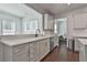 Kitchen features white countertops and lots of natural light at 220 Eastmark Way, Fayetteville, GA 30214