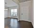 Bright living room with hardwood floors and large windows at 220 Eastmark Way, Fayetteville, GA 30214