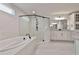 Bright main bathroom showcasing a soaking tub and a separate glass shower at 220 Eastmark Way, Fayetteville, GA 30214