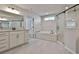 Modern main bathroom featuring granite countertops, soaking tub, and a walk-in shower at 220 Eastmark Way, Fayetteville, GA 30214