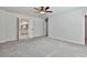 Spacious main bedroom featuring plush carpeting and an ensuite bathroom entrance at 220 Eastmark Way, Fayetteville, GA 30214