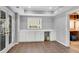 Basement area featuring built-in cabinets, countertop, and a view to the yard through french doors at 3015 Foxhall Overlook, Roswell, GA 30075