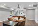 Finished basement featuring a comfortable seating area with a projector and tile flooring at 3015 Foxhall Overlook, Roswell, GA 30075