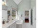 Bright bathroom featuring a large soaking tub, double sink vanity, and lots of natural light at 3015 Foxhall Overlook, Roswell, GA 30075