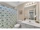 Bathroom with a white vanity, toilet, and shower with blue patterned shower curtain at 3015 Foxhall Overlook, Roswell, GA 30075