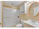 Bathroom with a sliding glass shower, vanity, toilet and decorative round mirror at 3015 Foxhall Overlook, Roswell, GA 30075