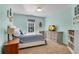 Bedroom with blue walls, large window, and neutral carpet and furnishings at 3015 Foxhall Overlook, Roswell, GA 30075