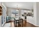 Charming dining area with natural light and hardwood floors, adjacent to the kitchen at 3015 Foxhall Overlook, Roswell, GA 30075