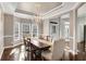 Elegant dining room featuring tray ceilings, chandelier, and an entry into the foyer at 3015 Foxhall Overlook, Roswell, GA 30075