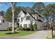 Beautiful home featuring a well-kept lawn, a driveway, and lush landscaping at 3015 Foxhall Overlook, Roswell, GA 30075