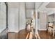 Welcoming foyer with hardwood floors, high ceilings, and natural light streaming through the doorway at 3015 Foxhall Overlook, Roswell, GA 30075