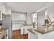 Spacious kitchen with granite countertops, stainless steel appliances, and a center island at 3015 Foxhall Overlook, Roswell, GA 30075
