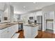 Bright kitchen featuring granite countertops, stainless steel appliances, and a center island at 3015 Foxhall Overlook, Roswell, GA 30075