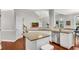 Well-equipped kitchen with an island and stainless appliances conveniently connecting to a dining area at 3015 Foxhall Overlook, Roswell, GA 30075