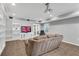 Basement living room with built in shelving, projector screen, and tiled floor at 3015 Foxhall Overlook, Roswell, GA 30075