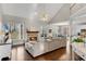 Inviting living room boasting a stone fireplace, hardwood floors, and an open layout at 3015 Foxhall Overlook, Roswell, GA 30075